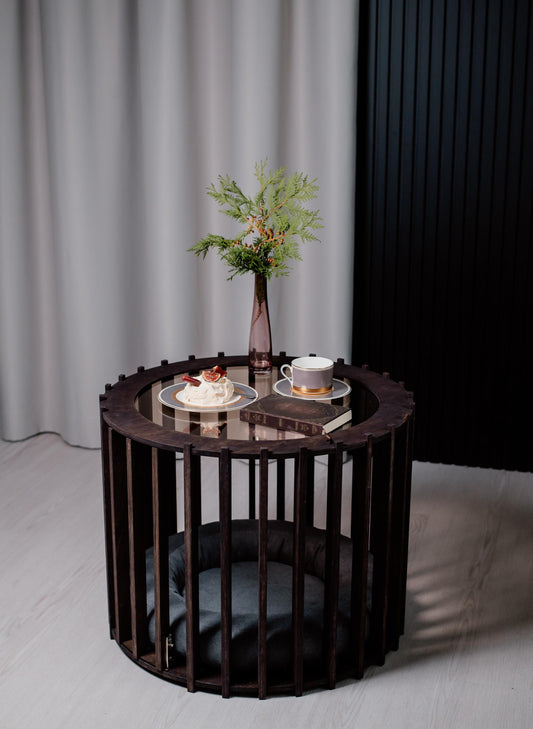 Dark wooden dog crate coffee table with round glass top – luxury indoor dog kennel furniture.