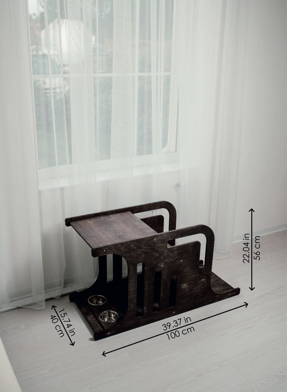 Modern indoor dog house with stairs placed near bed, stylish wooden dog crate furniture.