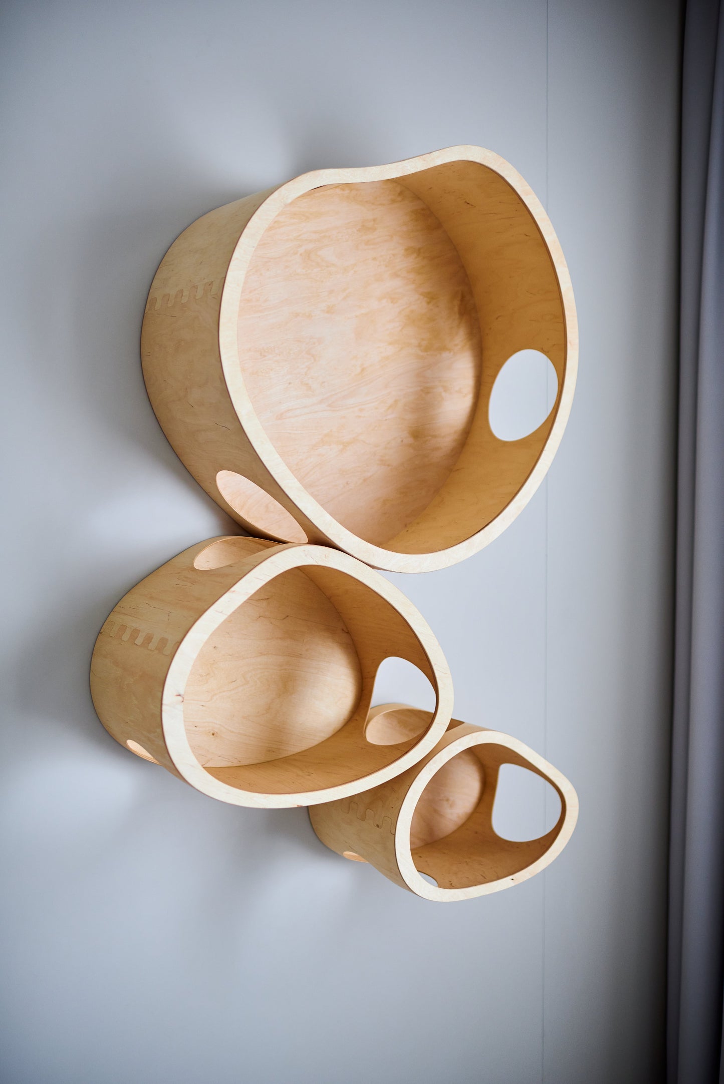 Wall mounted cat furniture set with small, medium and extra large wooden cat houses in light wood