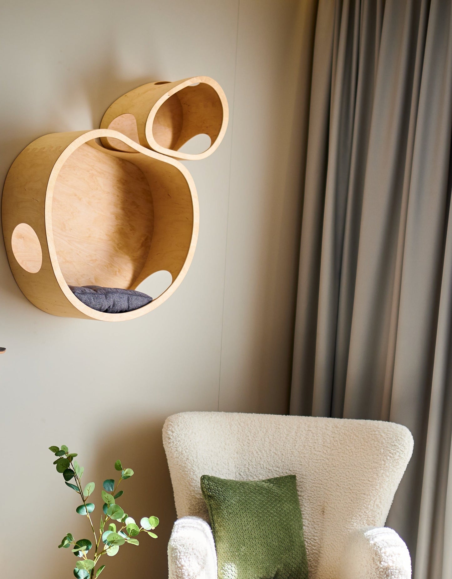 Natural wood cat tree with soft cushions