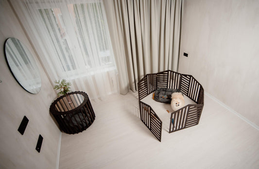 dark wooden dog playpen set up in a modern room with a small dog inside