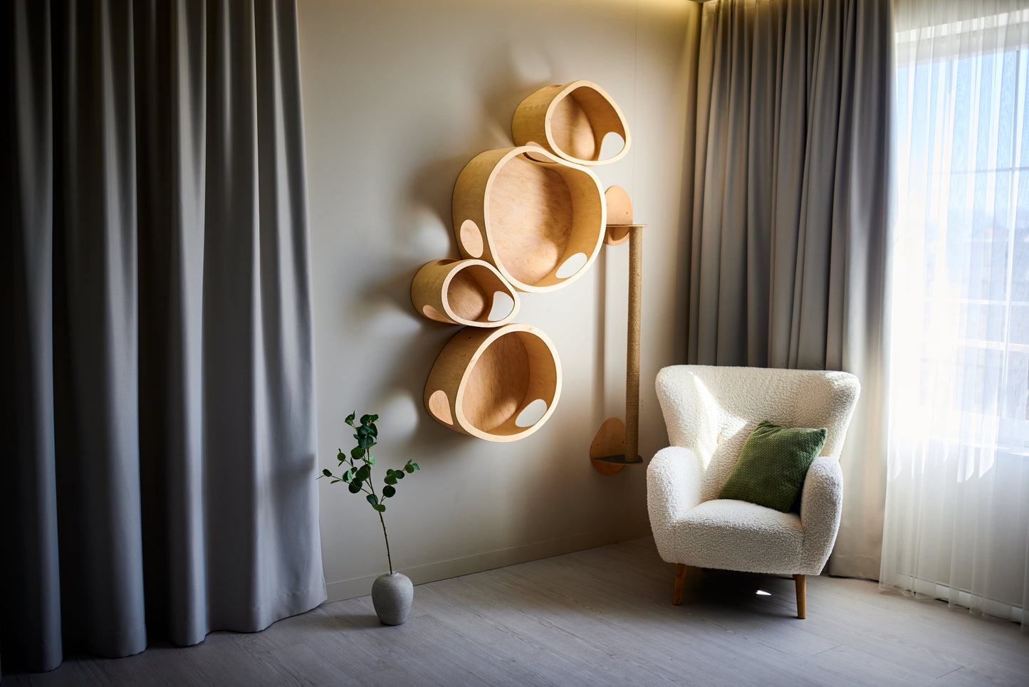Wall-mounted organic-shaped cat houses made from natural wood