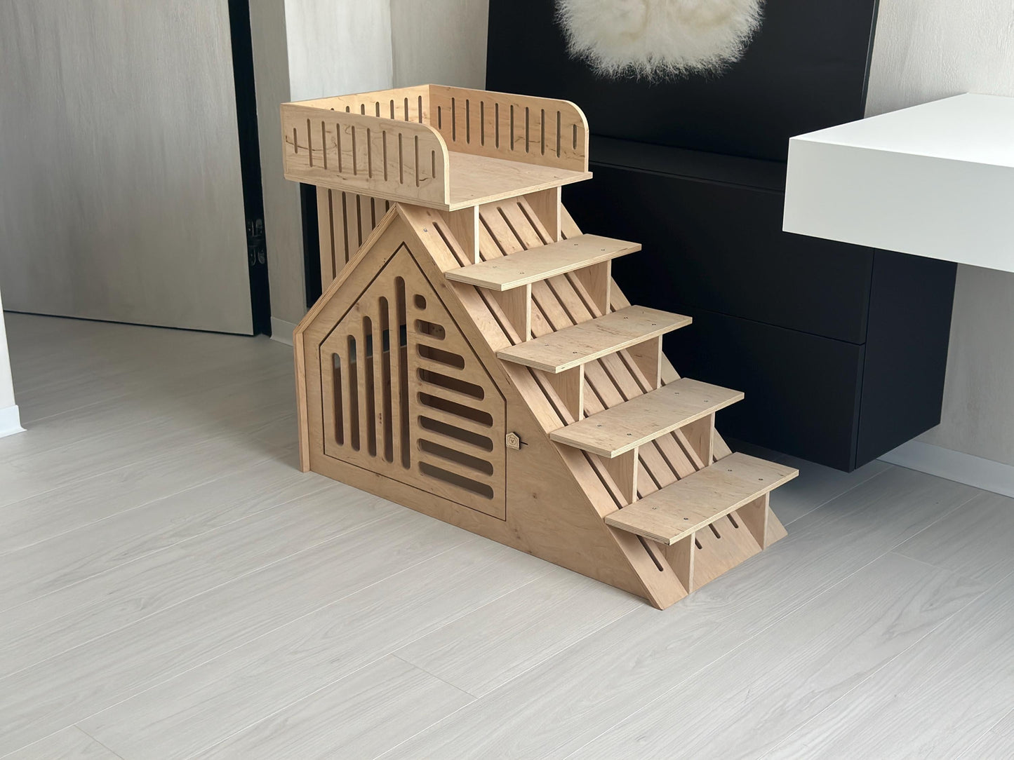 Wooden puppy steps attached to modern indoor dog house furniture