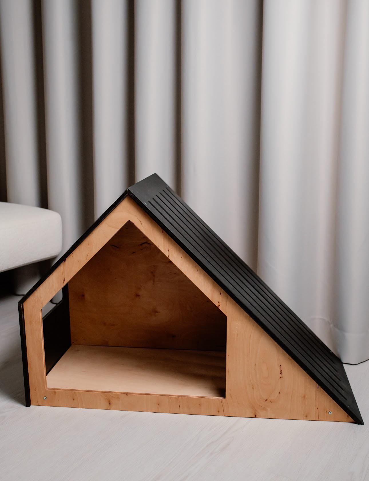 Side view of wooden dog house for small dogs and cats