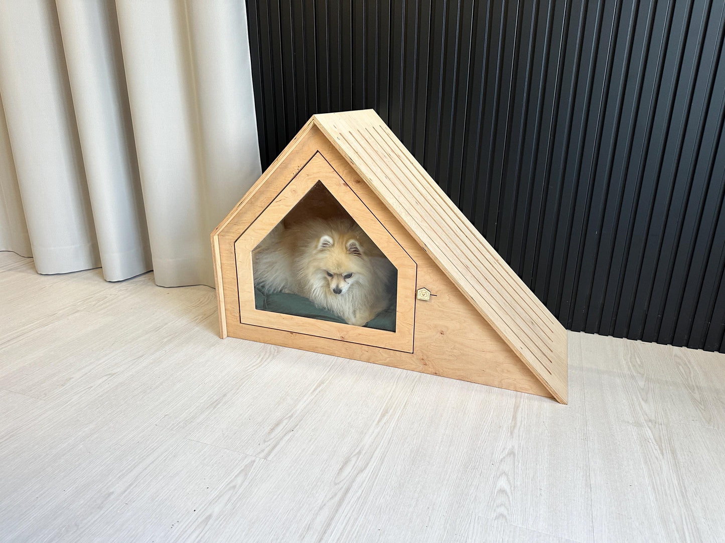modern wooden dog and cats house with small dog inside