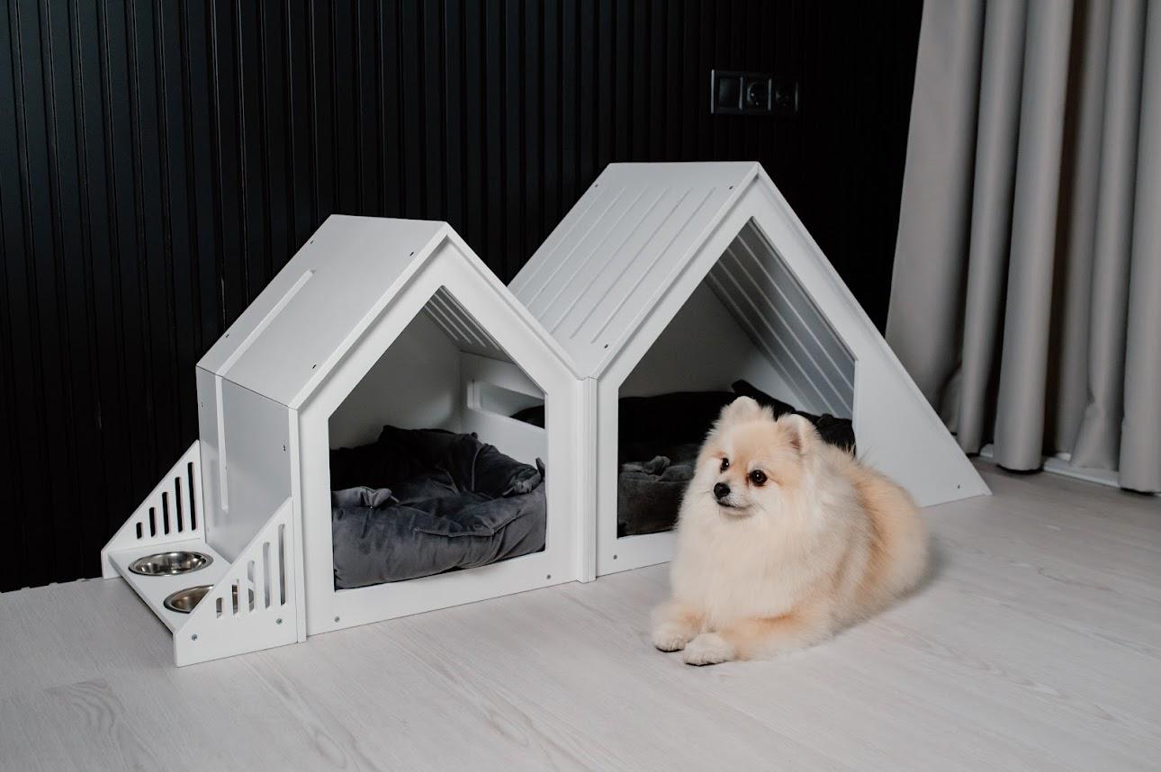 White wooden indoor dog house suitable for small dogs and cats, modern pet furniture for contemporary interiors.